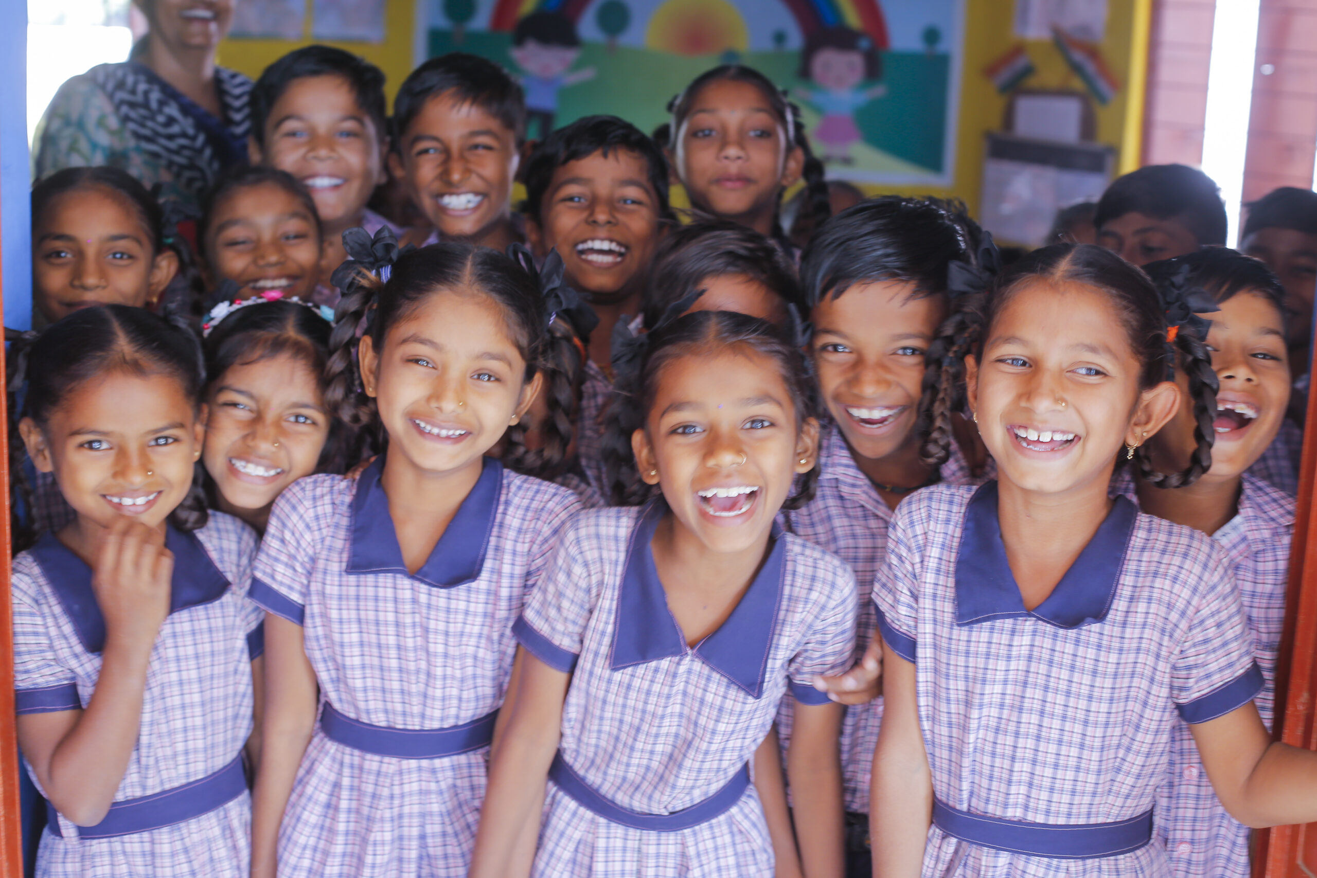 Child on scooter in garden