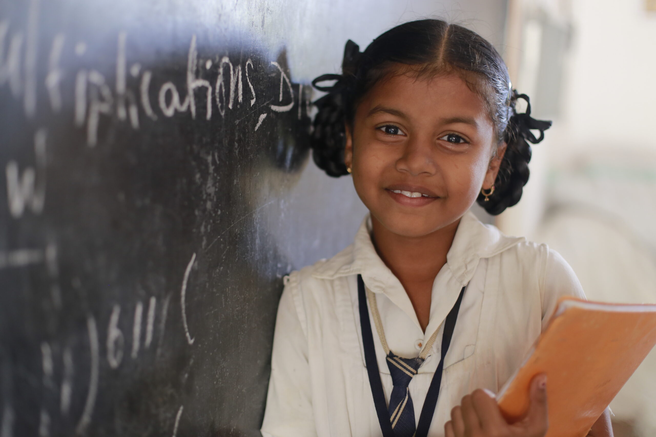 Smiling child with orange sunglasses
