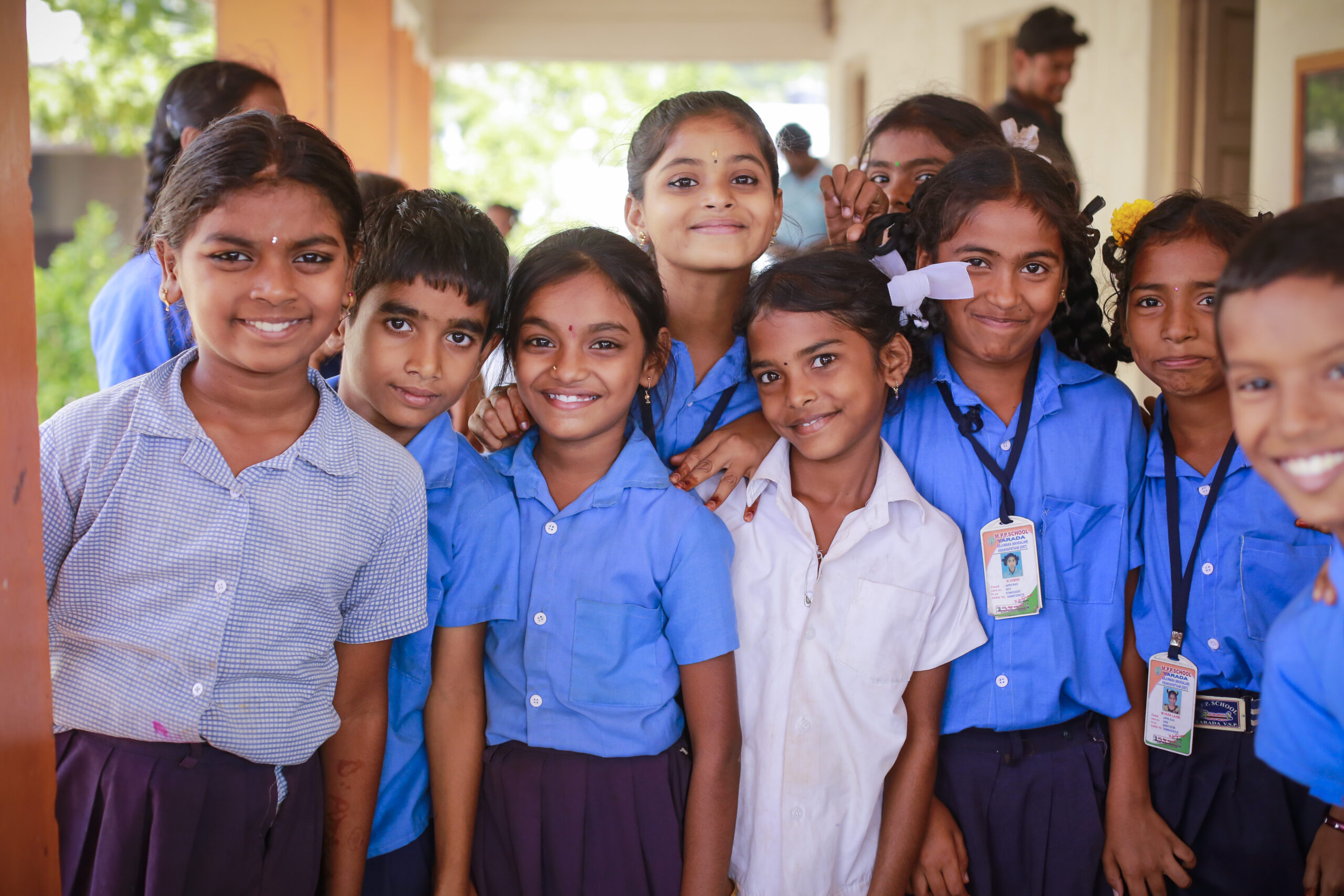 Diverse group of smiling children with educational books