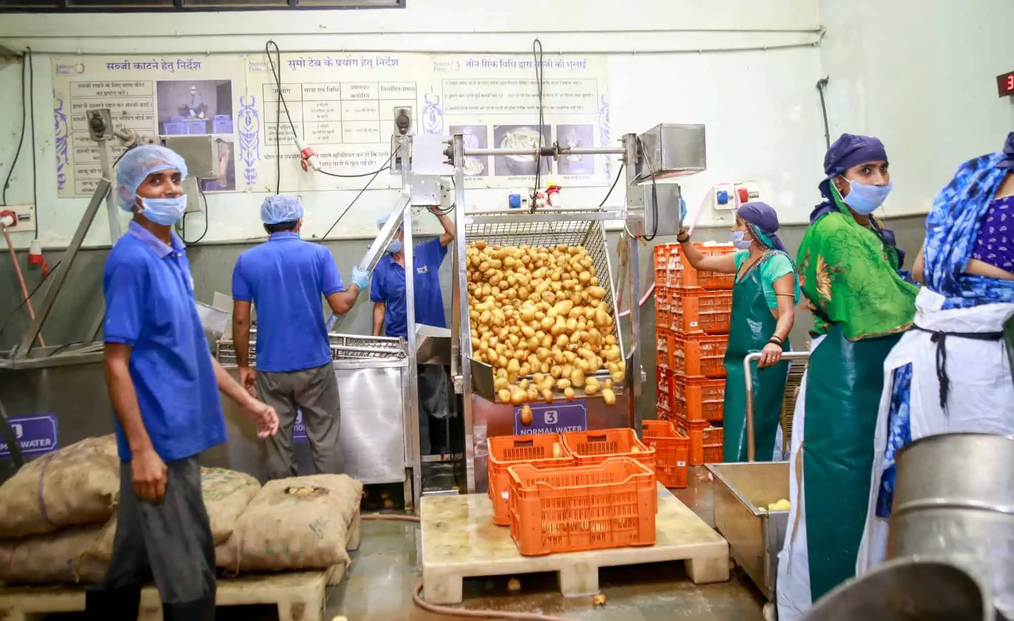 Kitchen workers preparing ingredients