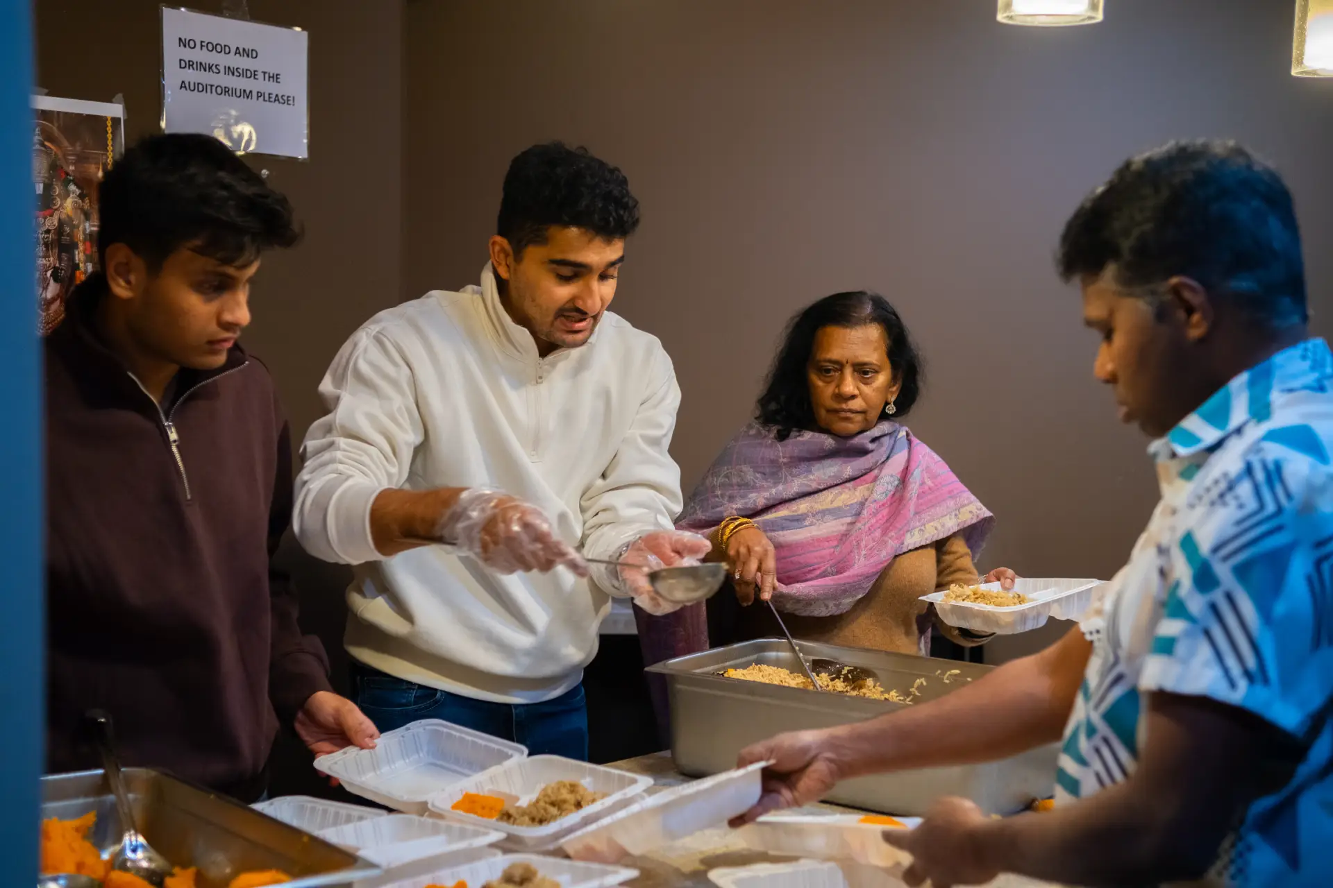 Chapter volunteers working together at a local Akshaya Patra event